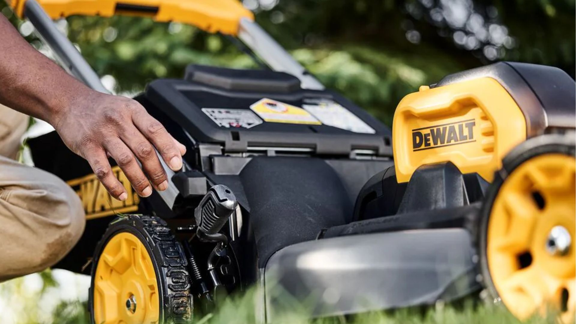 dewalt lawnmower close up with person's hand adjusting 